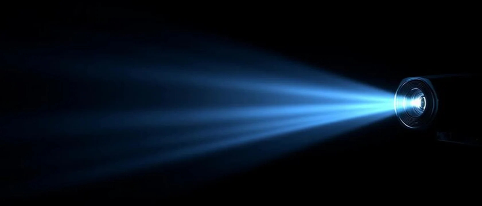 Film projector beam in dark cinema — Gotham CCSL Combined Continuity and Spotting List services